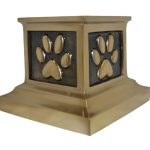Beautiful brass urn with a paw print to memorialize a pet
